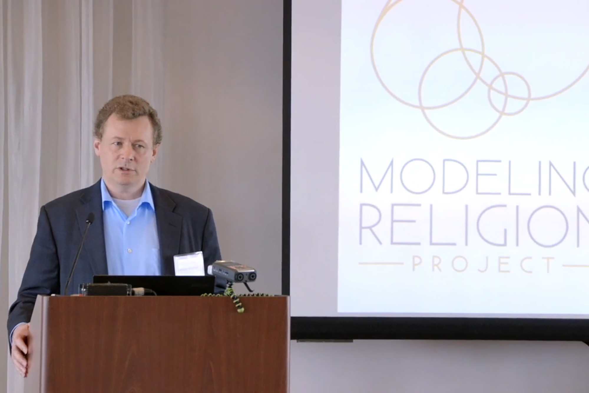 Photo of Wesley Wildman speaking at a podium