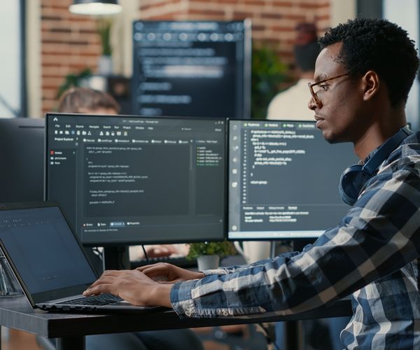 image of a male data scientist working on SQL coding