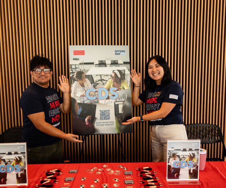 Photo of two CDS students tabling on Giving Day 2025