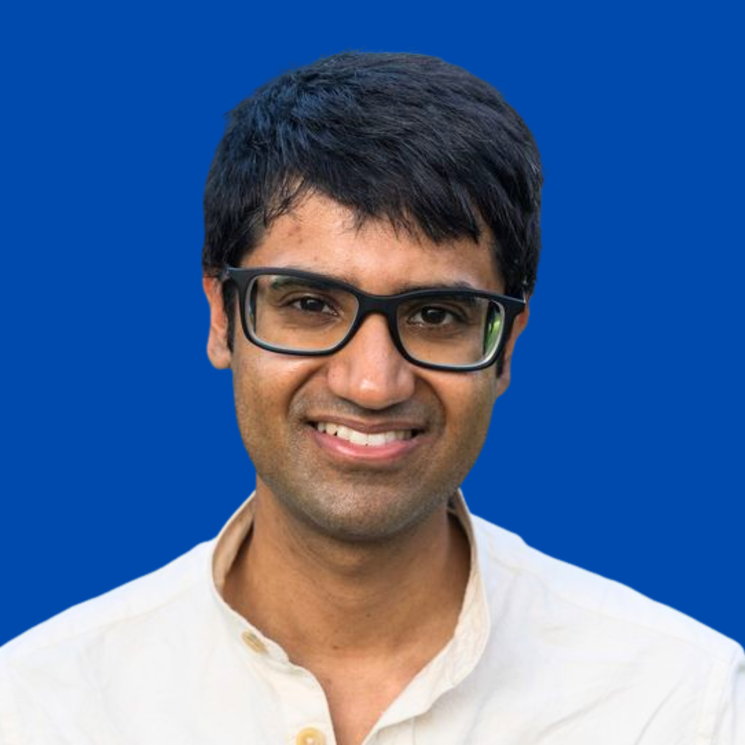 Headshot of Siddharth Mishra-Sharma in front of a blue background, Faculty of Computing & Data Sciences