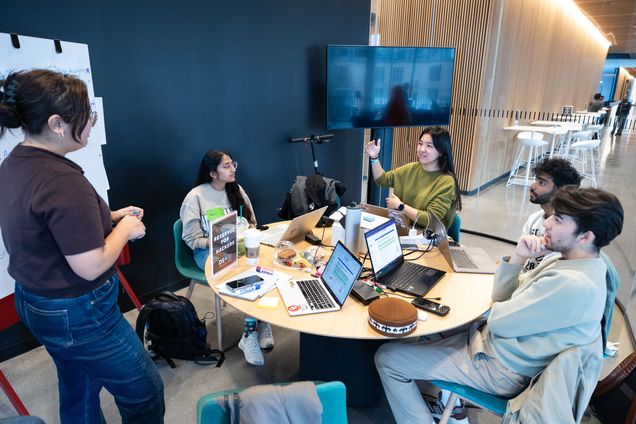 Students collaborating at the DS + X Hackathon 2025