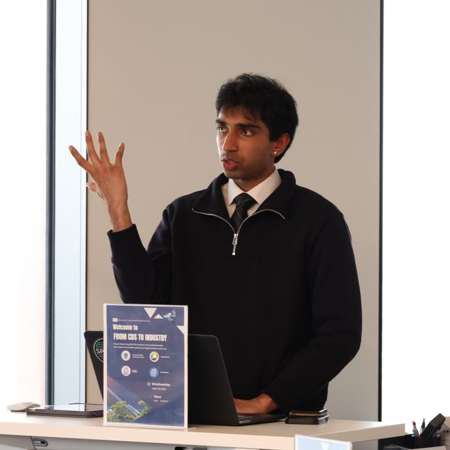 Photo of Kapilan Ramasamy speaking at podium