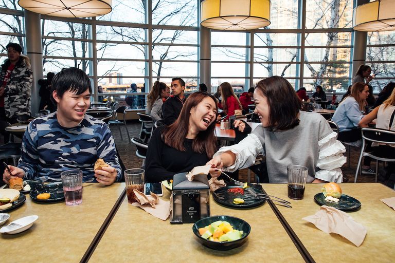 students enjoying a meal together in West Campus dining hall