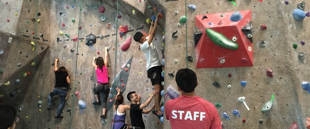 students on BU climbing wall at FIT Req