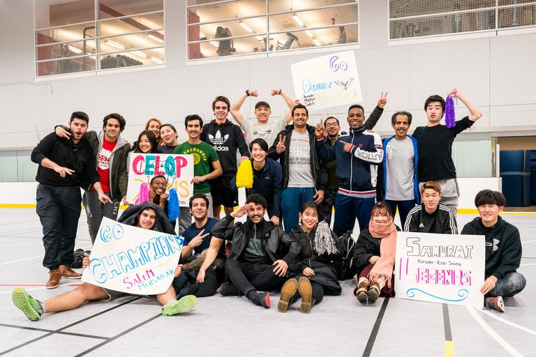 photo of CELOP students with team signs at BU gym