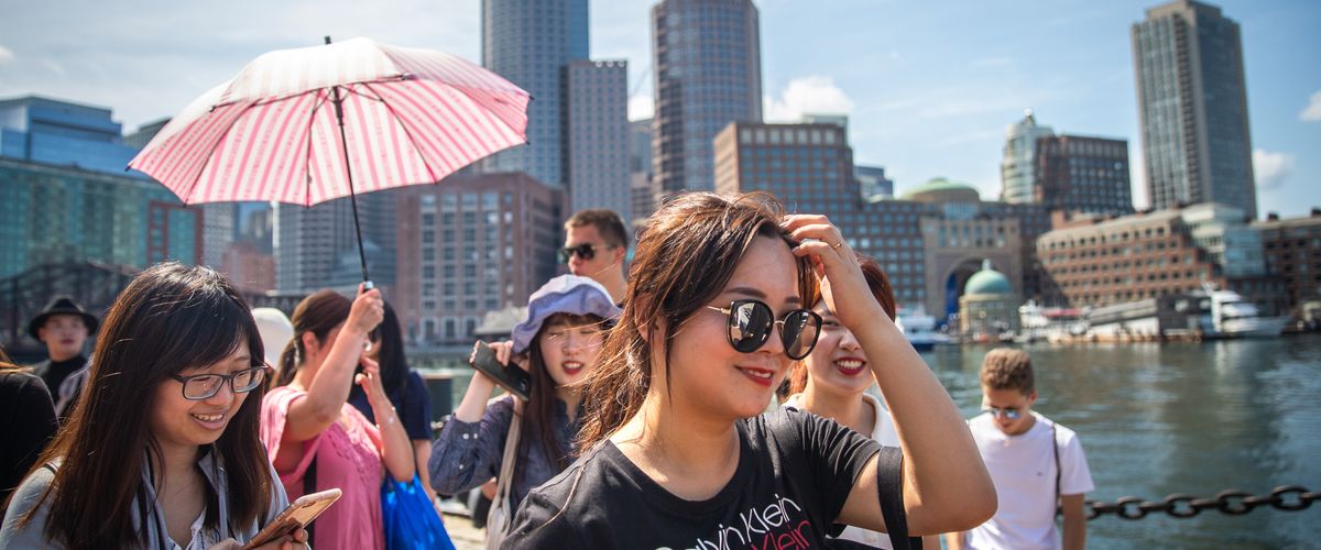 CELOP students walking along the boston harbor