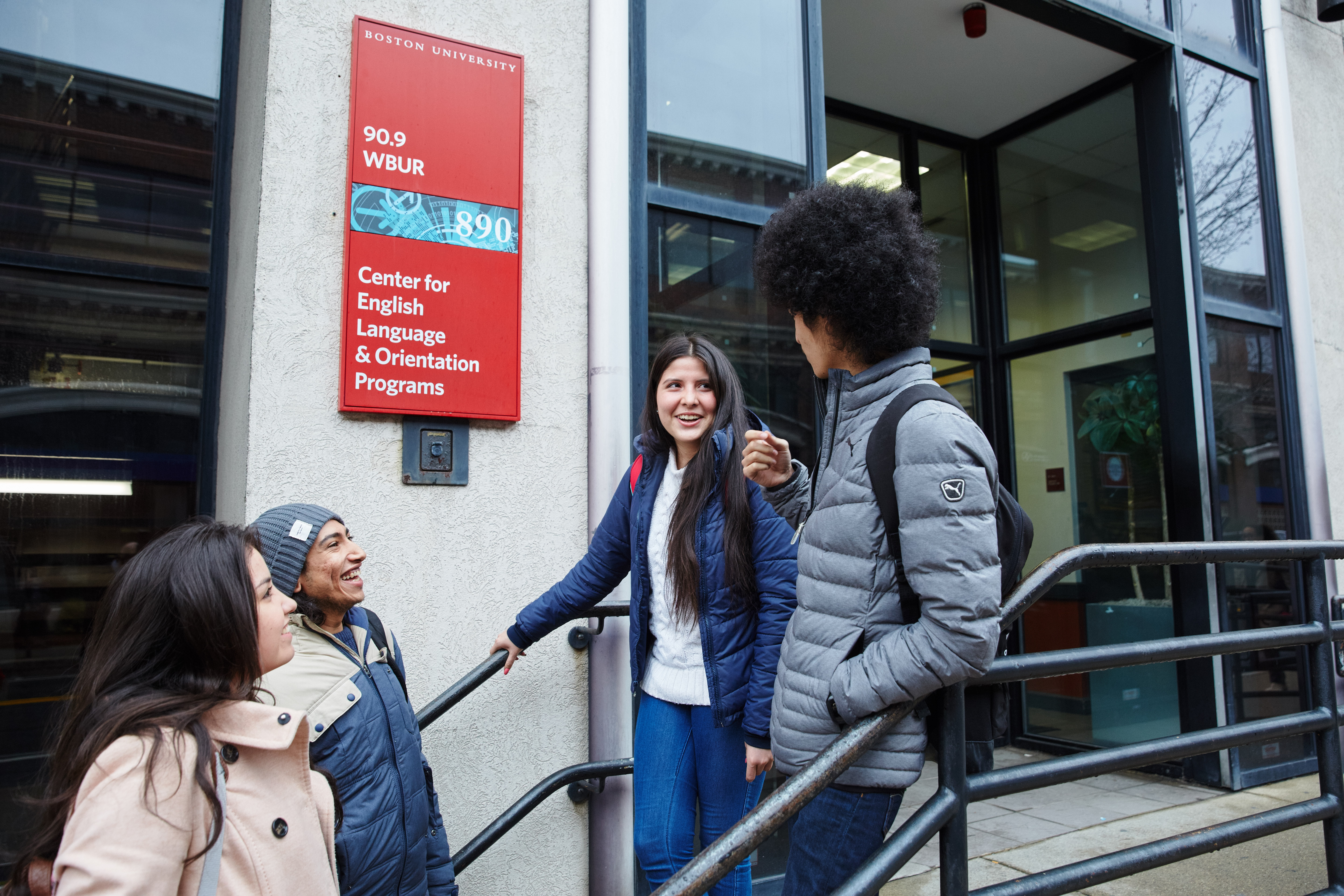 CELOP students walking down the stairs outside CELOP's building