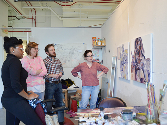 MFA Painting students discuss work in a critique setting.