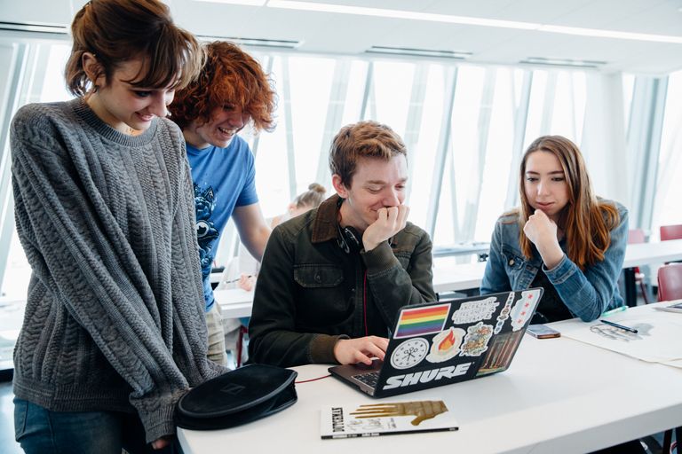 Students checking laptop