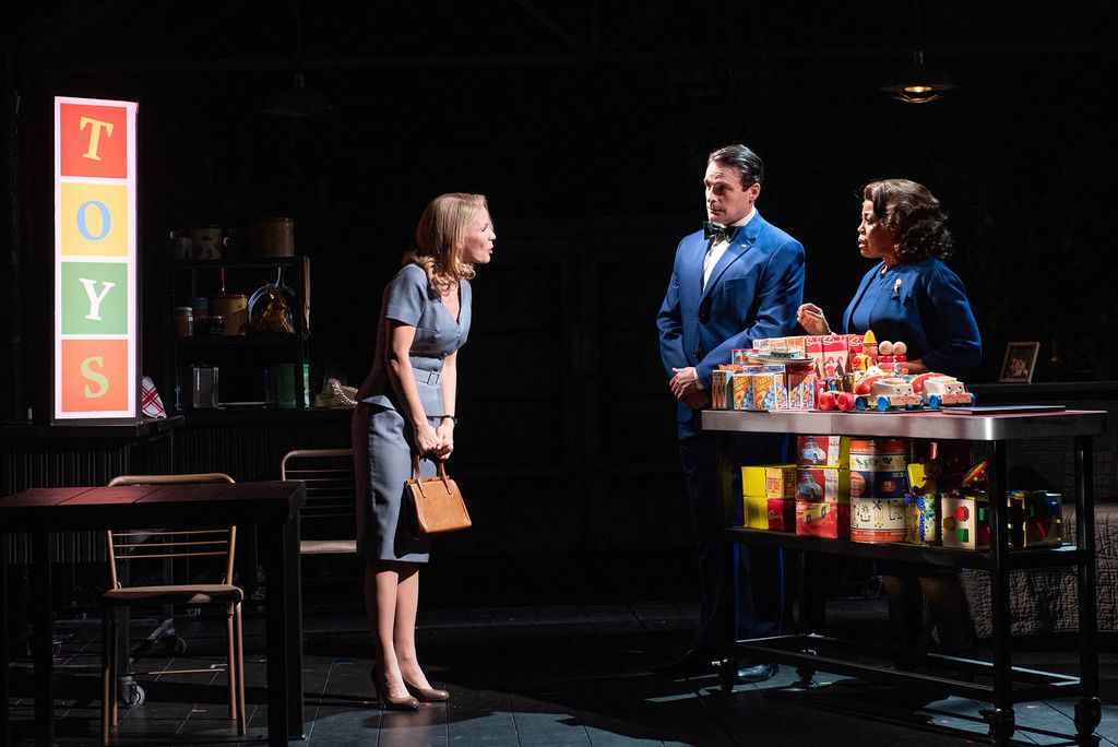 Kelli O’Hara (left) as Kirsten is buying a toy for the daughter she hasn’t seen in a while because of her alcoholism, a scene written especially for the musical.