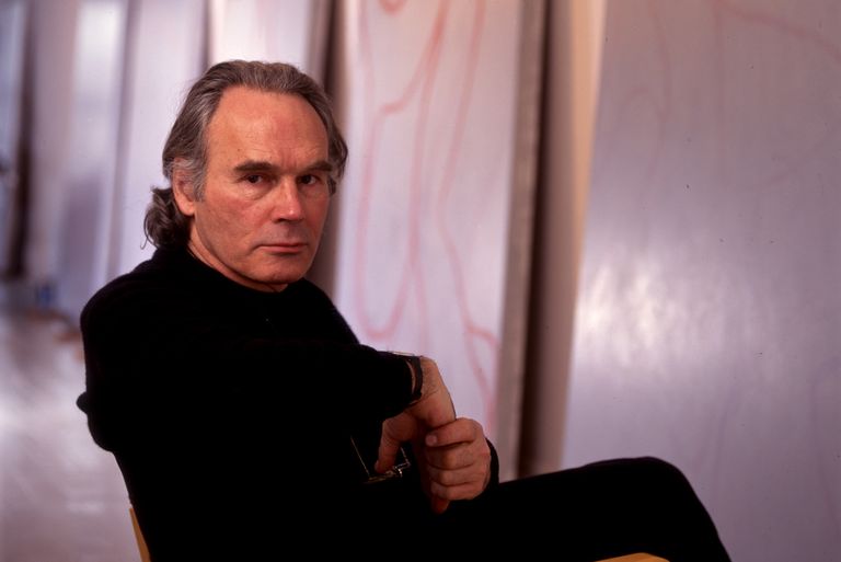 Painter Brice Marden sitting down on a chair in his studio in New York City.