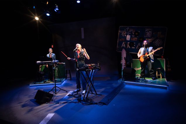 Writer and performer Jay Eddy (GRS’23) (center), with musicians Jordan Palmer (left) and Zach Fontanez in a scene from Driving in Circles, on stage at Boston Playwrights’ Theatre through April 6.