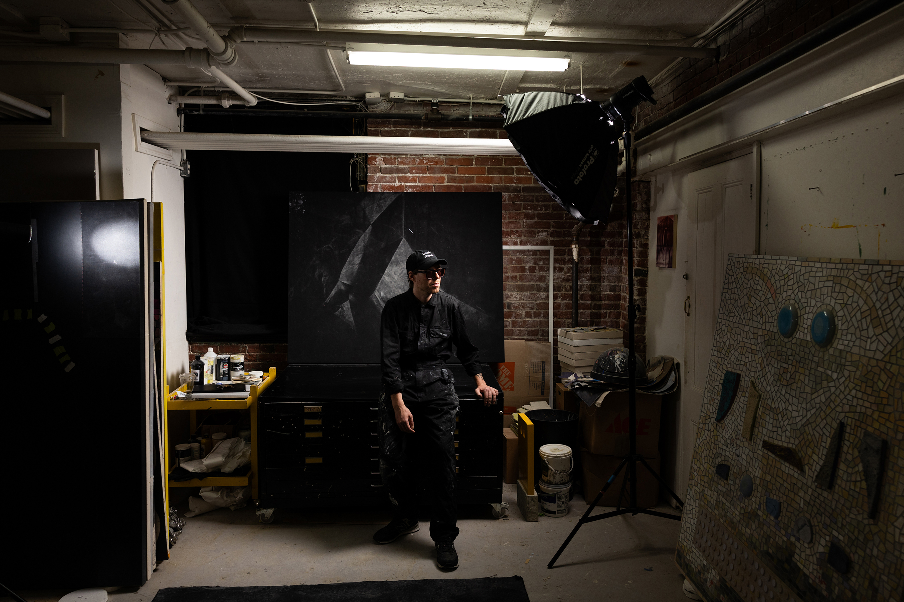 Artist S. Proski in their studio