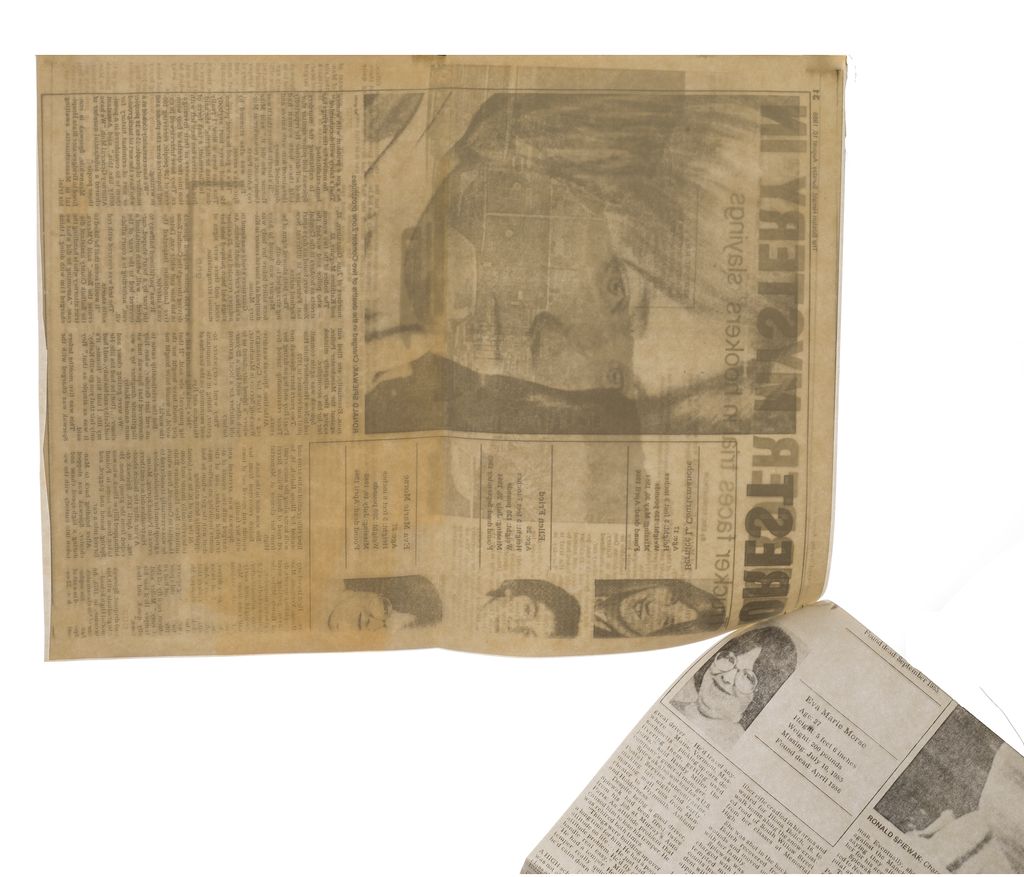 An open newspaper spread displaying several articles and photographs, including a large photo of a person's face on the left page. The newspaper appears old and yellowed with age, and the images and text cover various topics, with smaller portrait photos of individuals toward the bottom. The right page contains obituaries with names, dates, and brief descriptions.