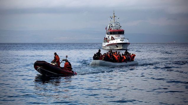 Officers of the EU border security agency, Frontex, pull a dinghy with migrants to Skala Sikaminias village on the northeastern Greek island of Lesbos, Oct. 21, 2015. - Copyright AP Photo/Santi Palacios