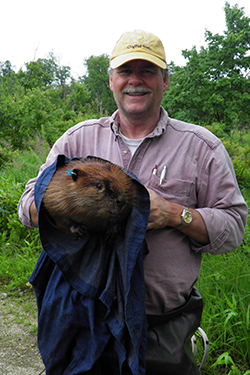 Peter Busher holds beaver