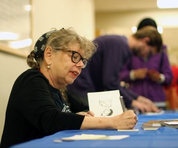 Lynda Barry signs books after delivering the Stanley P. Stone Distinguished Lecture 