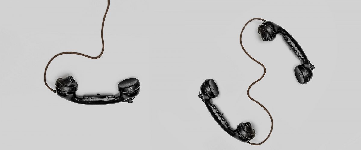 Three telephones connected to wires