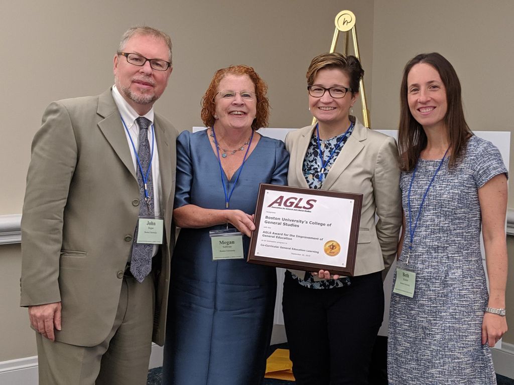 CGS faculty accept the AGLS Award. From left to right: John Regan, master lecturer, Department of Rhetoric; Megan Sullivan, associate dean for faculty research and development and director of the Center for Interdisciplinary Teaching and Learning; Karen Guendel, lecturer, Department of Rhetoric; Beth Kramer, senior lecturer, Department of Rhetoric. [credit Joyce Lucke, AGLS]