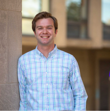 headshot of Alec on Marsh Plaza