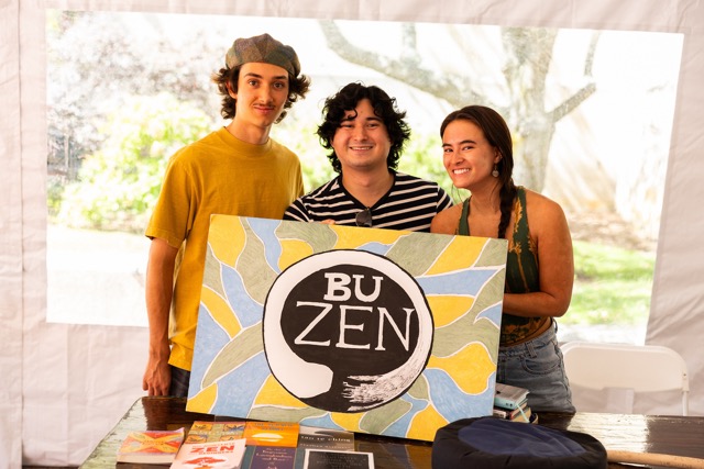 Members of BU Zen pose with their sign