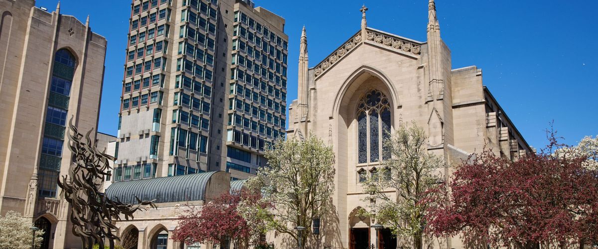 The front of Marsh chapel from the East. The MLK "Free at last" statue is visible along with a portion of the law school tower behind the chapel.