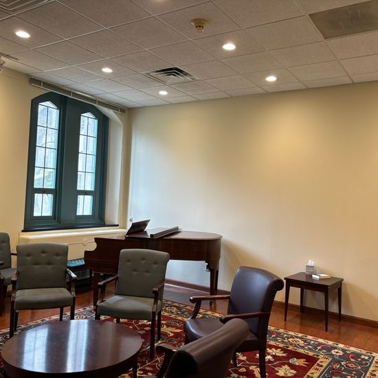 photo of the thurman room interior including windows and piano