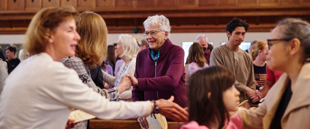 Members of the Marsh Congregation shake hands and share smiles and greetings during the Easter worship service.