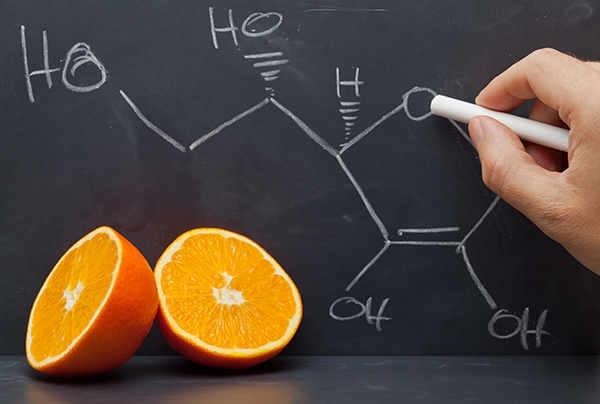 orange with chalkboard and vitamin c equation