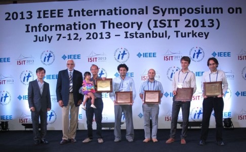 In July, Assistant Professor Bobak Nazer (ECE) and Professor Michael Gastpar of EPFL and UC Berkeley received a 2013 Joint Paper Award from the IEEE Communications Society and IEEE Information Theory Society. Pictured from left at the Istanbul award ceremony are Professor Edmund Yeh, Secretary of the Board of Governors of the IEEE Information Theory Society; Professor Abbas El Gamal, First Vice President of the IEEE Information Theory Society; fellow winners, Professors David Tse (UC Berkeley), Suhas Diggavi (UCLA), and Salman Avestimehr (Cornell); Gastpar and Nazer.