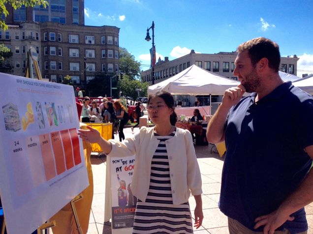 Yunwen Ou (L) explains to Danny Pezzano, a #BUCPUA Academic Program Manager, how long it takes for different materials to decompose.
