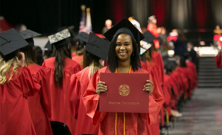 Student shows off her Boston University diploma