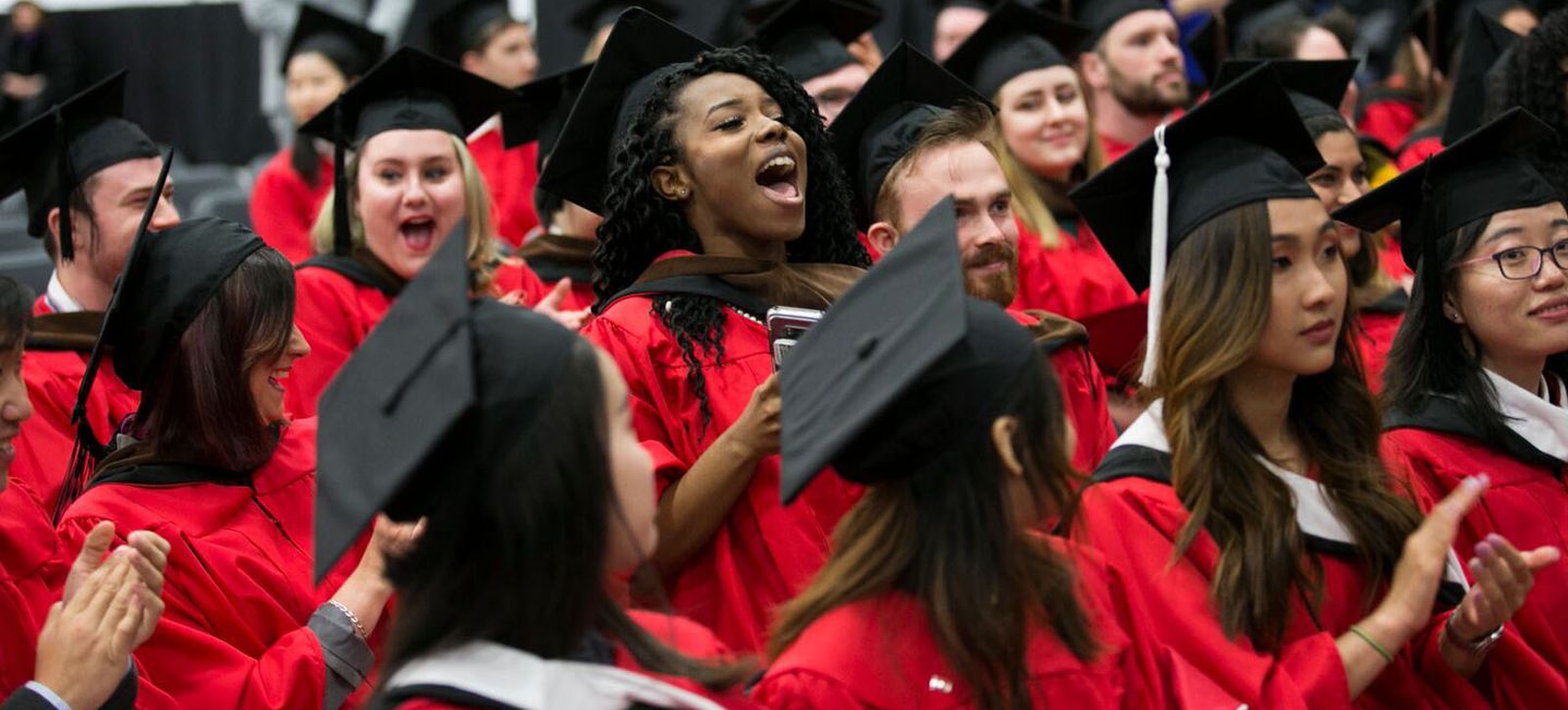 Students cheering at Commencement ceremony.