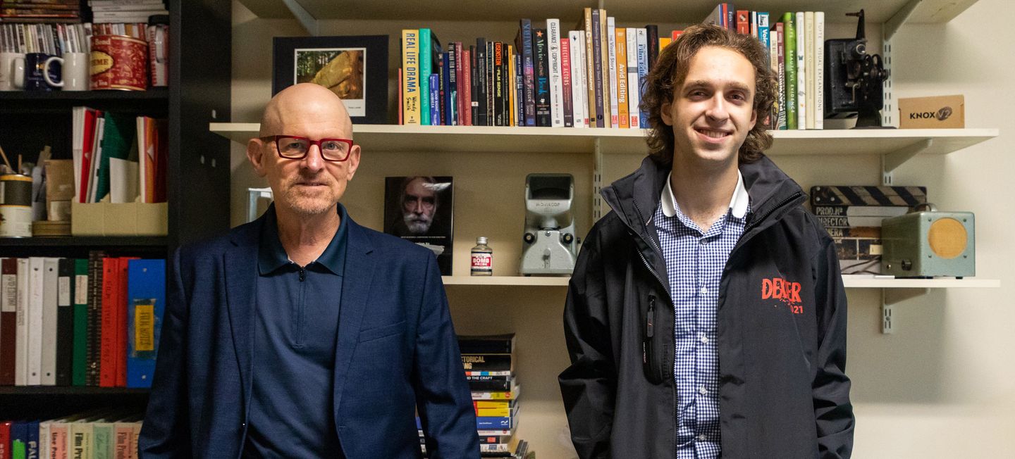 Charles Merzbacher and Gerald Hinch standing in front of a desk.