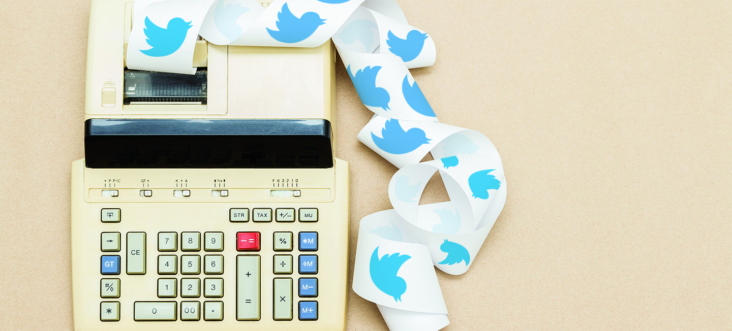 Ticker-tape calculator with Twitter bird illustrations on the tape.