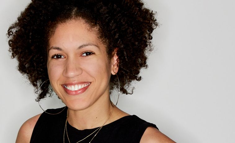 Smiling portrait of Raquel Wilbun in a black, sleeveless top.