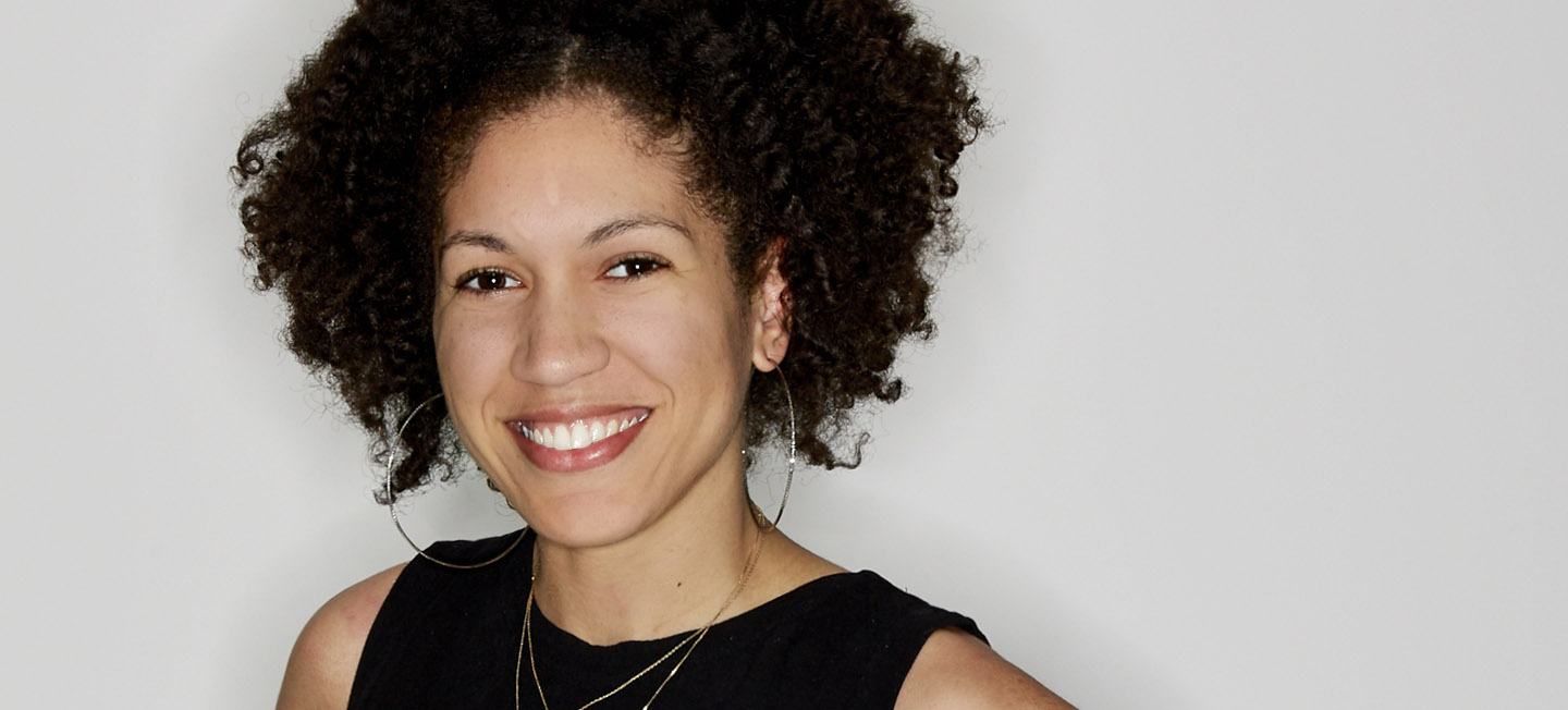 Smiling portrait of Raquel Wilbun in a black, sleeveless top.