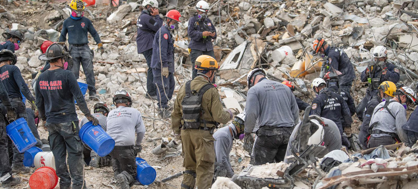 Crew at site of Surfside condo collapse working in the rubble.