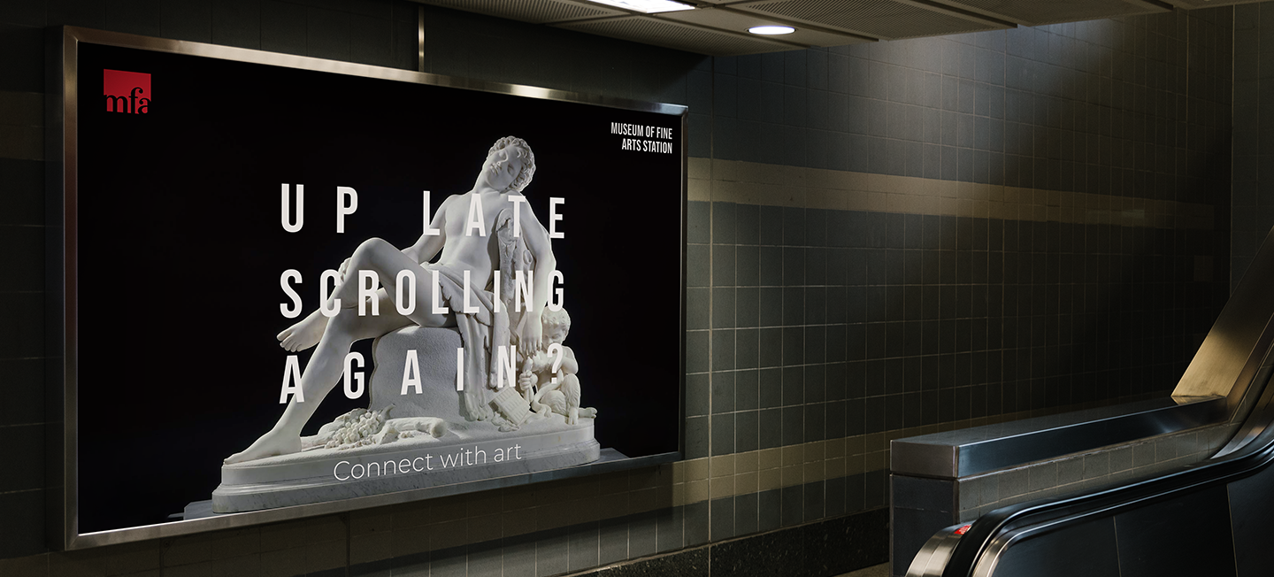 Poster framed near subway escalator.