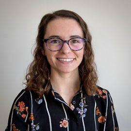 Hannah Schoenbaum smiling portrait.