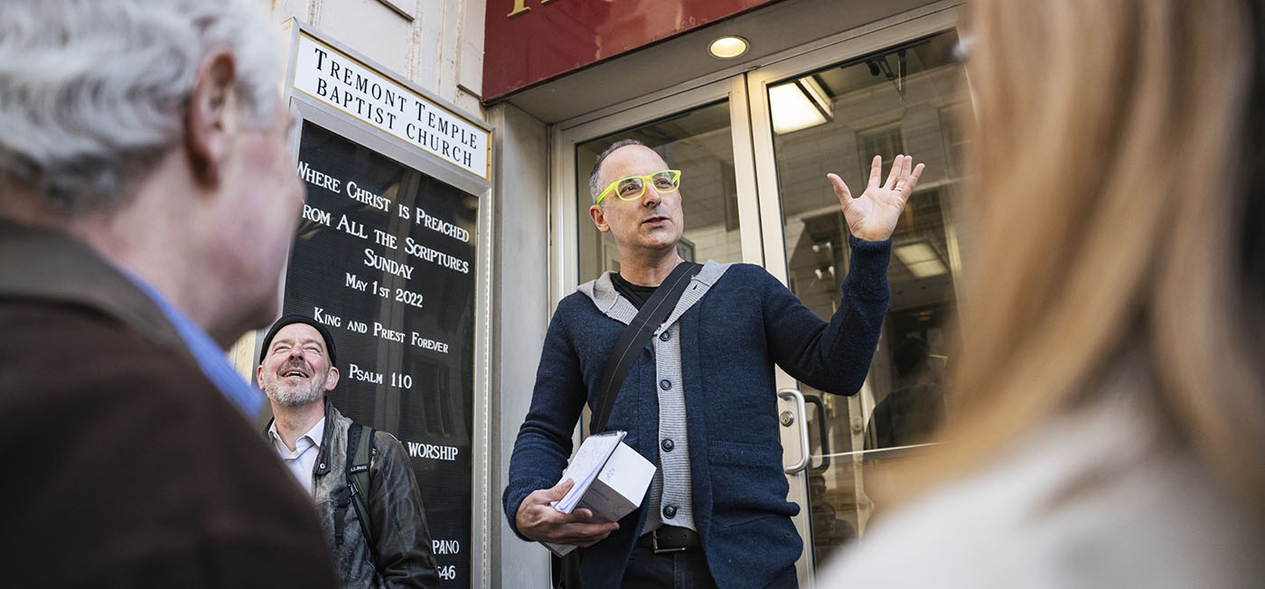 Scott Kirsner speaks in front of a small crowd during a stop on Boston's Innovation Trail.