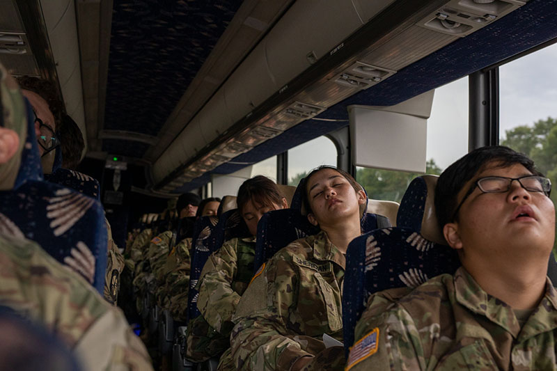 Army ROTC cadets sleeping on a bus.