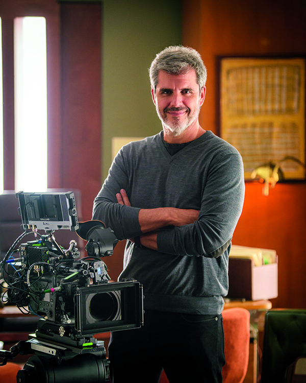 Carlos Bardasano posing with camera.