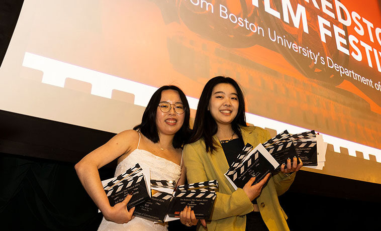Emily Ma (CAS’23, COM’23) (left) and producer Jessica Yijie Chen (COM’23) pose with their Redstone Film Festival awards.