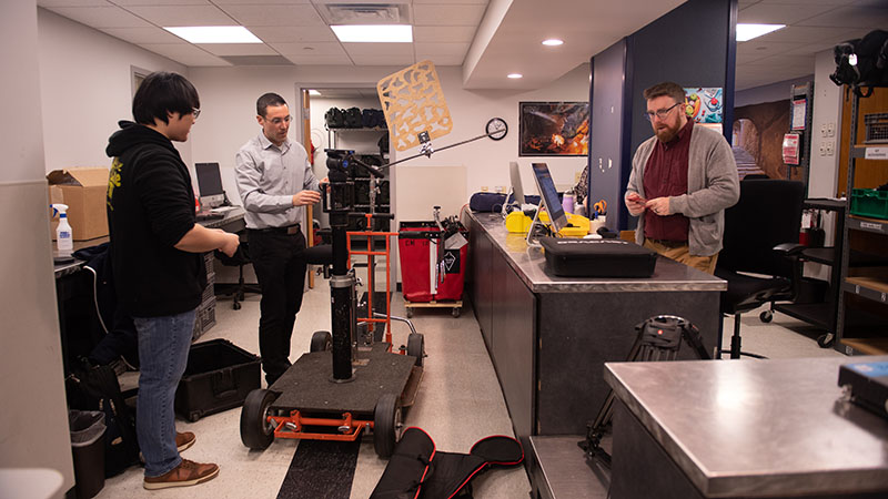 Brad Fernandes demonstrates a dolly set-up to student Jacob Lee.