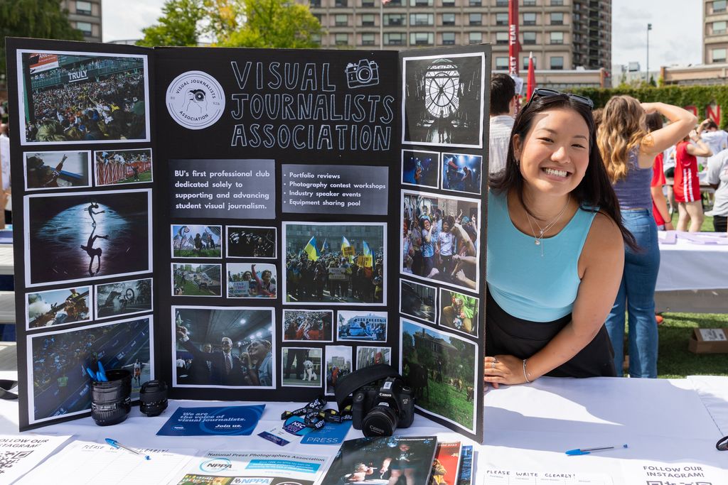 Student smiling at VJA exhibition