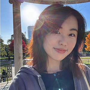 Smiling selfie style portrait with sunny sky