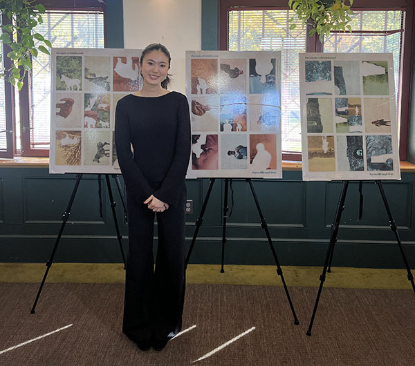 Helena Wang stands with her winning posters.
