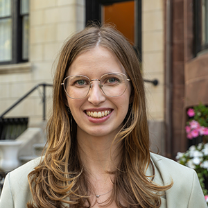 A professional portrait of Emily Wyrwa in a suit.