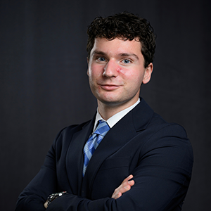 A portrait photo of George Lehman in a suit. 